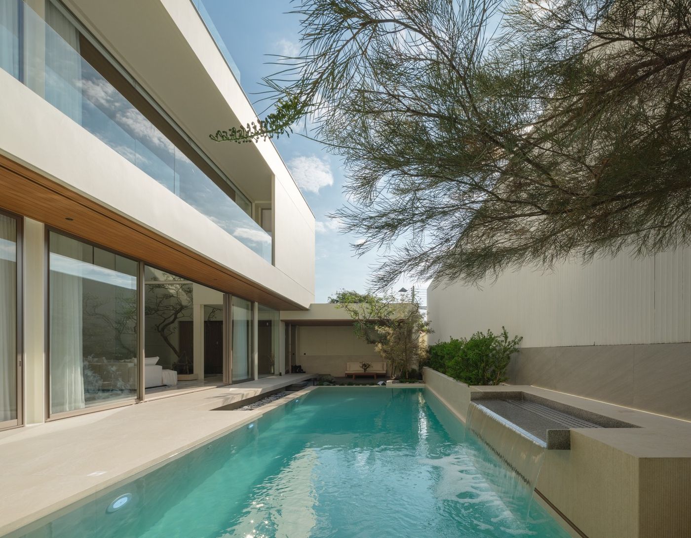 Airbnb pool villa Chiang Mai short-term rental — resort pool with palm trees