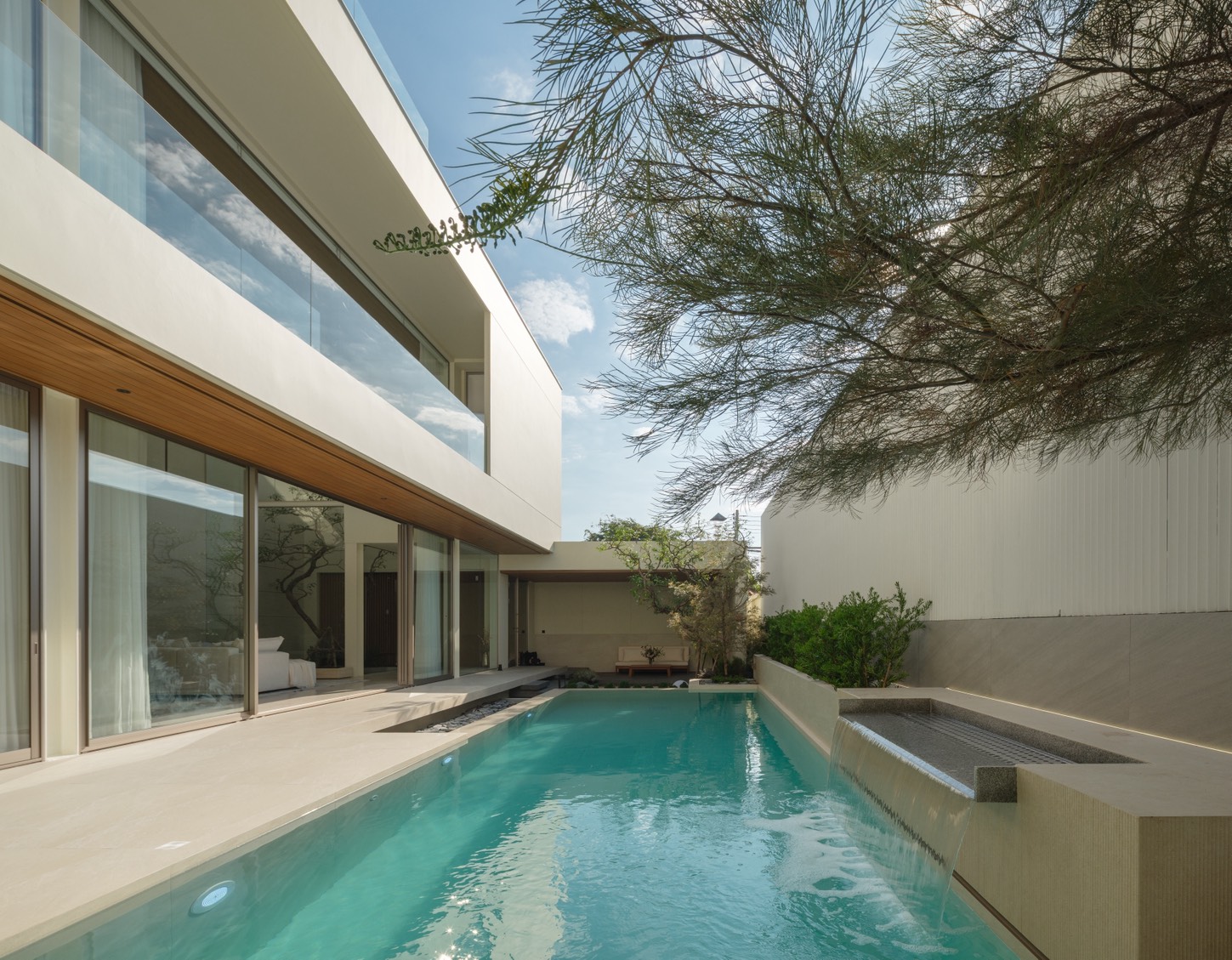 Airbnb pool villa Chiang Mai short-term rental — resort pool with palm trees